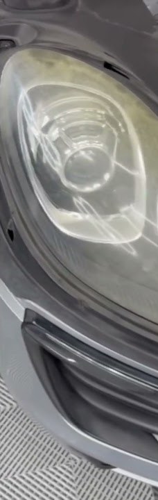 Close-up of a Porsche Macan headlight restored with PPF