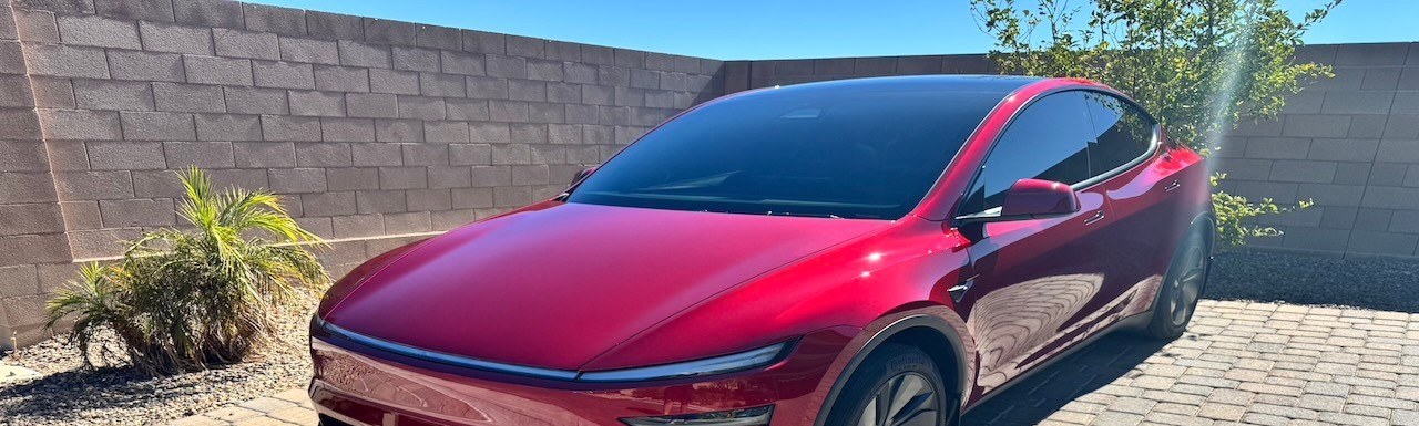 Red Tesla Model Y with ceramic tint, PPF and ceramic coating